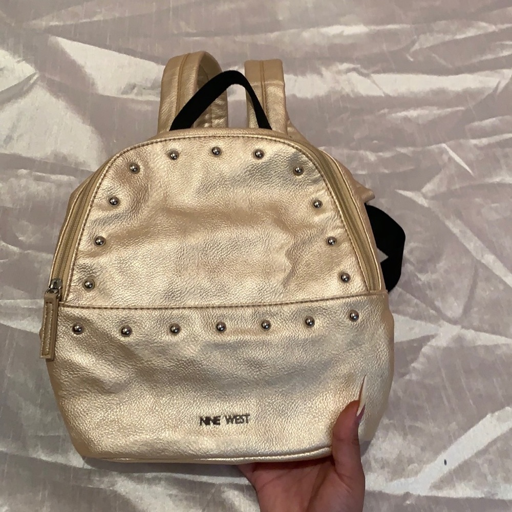 Gold Nine West mini backpack.